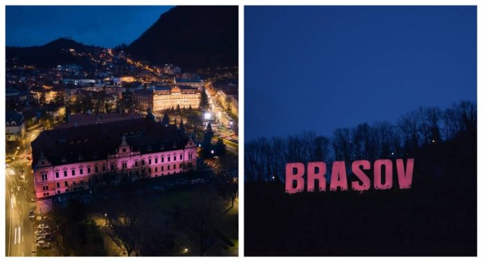 Clădirea Primăriei și literele de pe Tâmpa, iluminate în roz, de Ziua internațională a luptei împotriva cancerului la sân